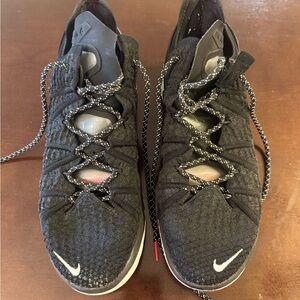 Nike Black Athletic Shoes with Mesh Upper and Mid-Top Design